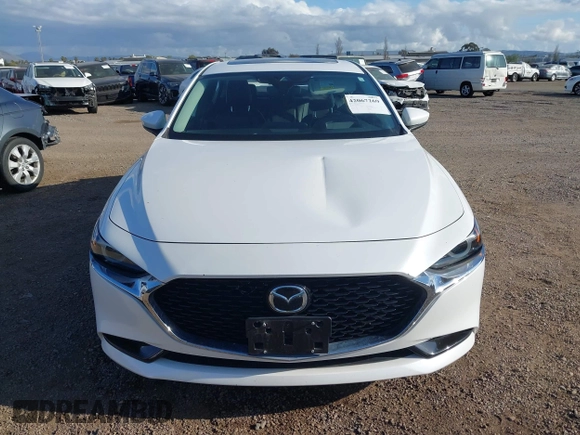 2020 Mazda 3 Premium with VIN 3MZBPAEM3LM132772, listed as a IAAI auction lot 42067269 with 53,751 mi miles and . Bid and sale history available at DreamBid. Image 12.