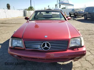 1999 Mercedes-Benz SL-Class with VIN WDBFA68F3XF184908, listed as a Copart auction lot 77165784 with 67,408 mi miles and Salvage Title. Bid and sale history available at carsss.com. Image 5.