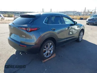 2022 Mazda CX-30 S Select z VIN 3MVDMBBL0NM415511, wystawiony jako IAAI lot #41513247 z przebiegiem Nie podano mil oraz . Historia ofert i sprzedaży dostępna na DreamBid. Obrazek 4.