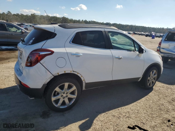 2018 Buick Encore Essence with VIN KL4CJCSBXJB645684, listed as a Copart auction lot 84900194 with 65659 miles and Salvage Title. Bid and sale history available at carsss.com. Image 3.