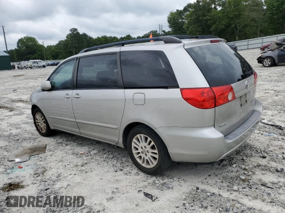 2010 Toyota Sienna XLE with VIN 5TDYK4CC1AS322395, listed as a Copart auction lot 60520215 with 148,725 mi miles and Salvage title. Bid and sale history available at DreamBid. Image 2.