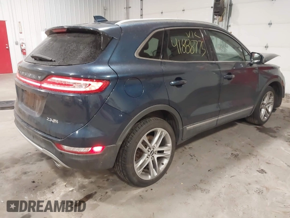 2015 Lincoln MKC with VIN 5LMTJ2AH0FUJ28744, listed as a IAAI auction lot 41888775 with 145,872 mi miles. Bid and sale history available at carsss.com. Image 4.