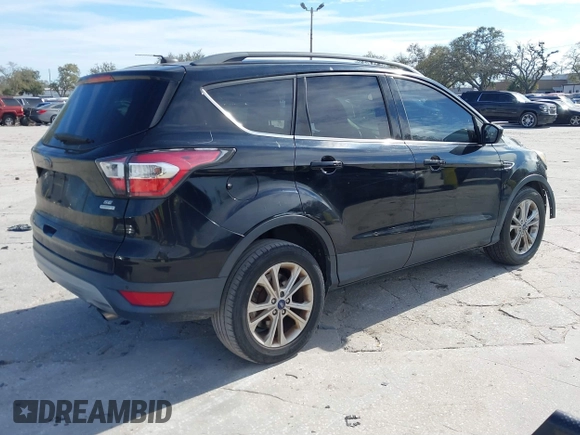 2017 Ford Escape SE with VIN 1FMCU0GDXHUB56573, listed as a IAAI auction lot 41694558 with 145,902 mi miles. Bid and sale history available at carsss.com. Image 4.