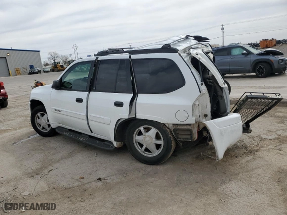 2003 GMC Envoy SLE with VIN 1GKDS13SX32259798, listed as a Copart auction lot 48712015 with 100,330 mi miles and Salvage Title. Bid and sale history available at carsss.com. Image 2.