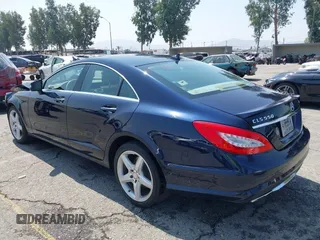 2014 Mercedes-Benz CLS 550 with VIN WDDLJ9BB9EA090821, listed as a IAAI auction lot 42582082 with 97,459 mi miles and . Bid and sale history available at DreamBid. Image 3.