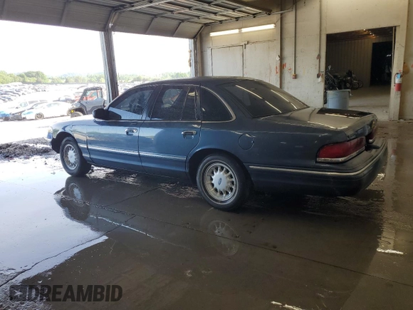 1997 Ford Crown Victoria LX с VIN 2FALP74W2VX109574, выставлен на аукционе Copart как лот 56222925 с пробегом 175 901 миль миль и Списание • Salvage title. История ставок и продаж доступна на DreamBid. Изображение 2.