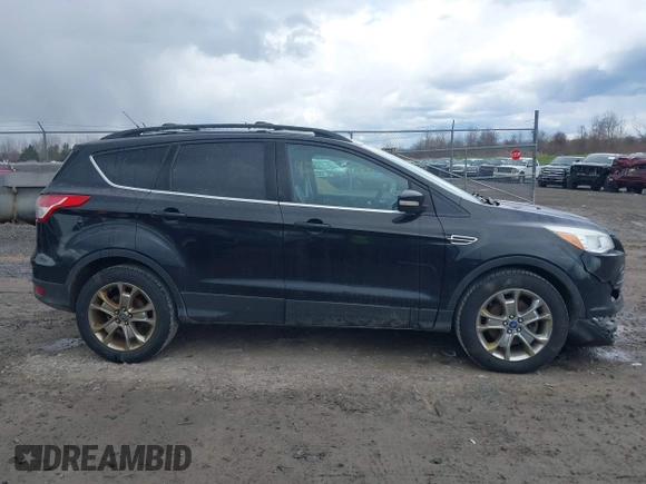 2013 Ford Escape SEL with VIN 1FMCU9HX9DUA69853, listed as a IAAI auction lot 42037021 with 132,166 mi miles and . Bid and sale history available at DreamBid. Image 14.