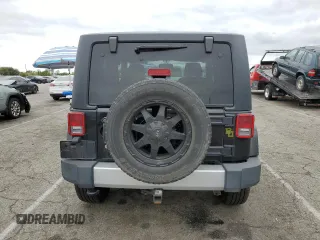 2015 Jeep Wrangler Sahara z VIN 1C4AJWBG2FL614702, wystawiony jako Copart lot #53516315 z przebiegiem 91 899 mil mil oraz Szkoda całkowita • Salvage title. Historia ofert i sprzedaży dostępna na DreamBid. Obrazek 6.