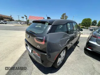 2014 BMW i3 with VIN WBY1Z4C51EV274633, listed as a Copart auction lot 64677185 with 61,664 mi miles and Clean title. Bid and sale history available at DreamBid. Image 4.