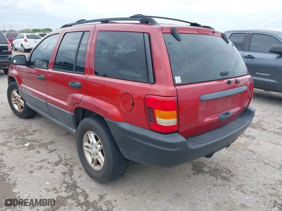 2004 Jeep Grand Cherokee Laredo with VIN 1J4GX48S14C259215, listed as a IAAI auction lot 41906121 with 142,668 mi miles. Bid and sale history available at carsss.com. Image 3.