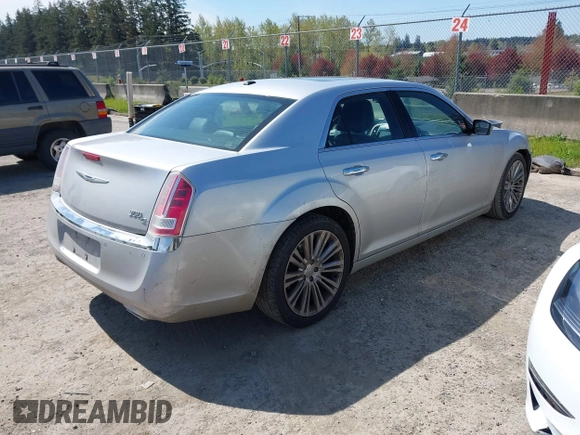 2012 Chrysler 300 with VIN 2C3CCAET2CH207796, listed as a IAAI auction lot 42029639 with 142,929 mi miles. Bid and sale history available at carsss.com. Image 4.