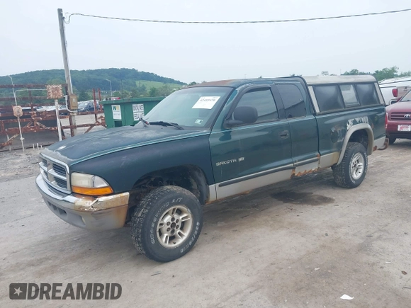 1999 Dodge Dakota SLT z VIN 1B7GG22X0XS104969, wystawiony jako IAAI lot #42493470 z przebiegiem 160 019 mil mil oraz . Historia ofert i sprzedaży dostępna na DreamBid. Obrazek 2.