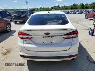 2017 Ford Fusion SE z VIN 3FA6P0H70HR328463, wystawiony jako Copart lot #57768095 z przebiegiem 115 950 mil mil oraz Nie do naprawy • Non repairable. Historia ofert i sprzedaży dostępna na DreamBid. Obrazek 6.