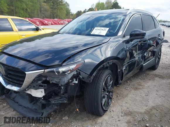 2022 Mazda CX-9 Touring Plus z VIN JM3TCBAYXN0613830, wystawiony jako IAAI lot #41942849 z przebiegiem 50 193 mil mil oraz . Historia ofert i sprzedaży dostępna na DreamBid. Obrazek 6.