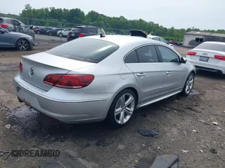 2014 Volkswagen CC Sport z VIN WVWBN7AN9EE524674, wystawiony jako IAAI lot #42252264 z przebiegiem 118 378 mil mil oraz . Historia ofert i sprzedaży dostępna na DreamBid. Obrazek 4.