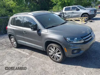 2012 Volkswagen Tiguan SE with VIN WVGAV7AX9CW002319, listed as a IAAI auction lot 41851289 with 143,098 mi miles and . Bid and sale history available at DreamBid. Image 1.