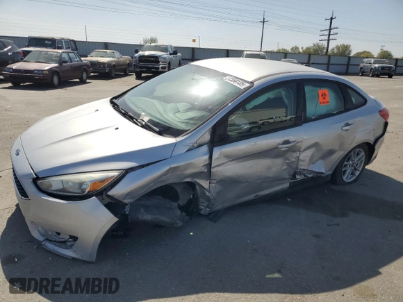 2015 Ford Focus SE with VIN 1FADP3F28FL241020, listed as a Copart auction lot 54559135 with 123,008 mi miles and Salvage title. Bid and sale history available at DreamBid. Image 1.