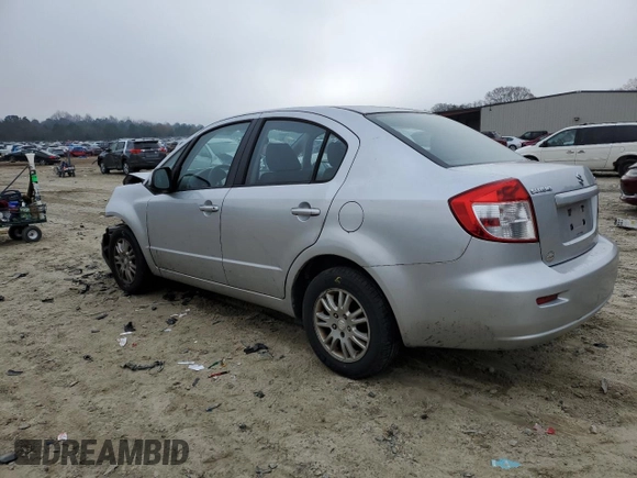 2012 Suzuki SX4 LE with VIN JS2YC5A39C6305357, listed as a Copart auction lot 84146324 with 163,097 mi miles and Salvage Title. Bid and sale history available at carsss.com. Image 2.