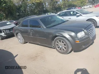 2009 Chrysler 300 Touring with VIN 2C3LA53V09H520923, listed as a IAAI auction lot 40408803 with 216,747 mi miles. Bid and sale history available at carsss.com. Image 1.