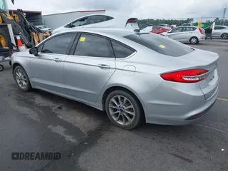 2017 Ford Fusion Hybrid SE with VIN 3FA6P0LU2HR317784, listed as a IAAI auction lot 42618554 with 114,814 mi miles and . Bid and sale history available at DreamBid. Image 3.