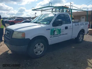2005 Ford F-150 XL with VIN 1FTRF12W95NB42063, listed as a IAAI auction lot 41874938 with 254,029 mi miles. Bid and sale history available at carsss.com. Image 2.