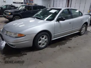 2003 Oldsmobile Alero GL1 z VIN 1G3NL52F53C112582, wystawiony jako IAAI lot #41926039 z przebiegiem 124 769 mil mil oraz . Historia ofert i sprzedaży dostępna na DreamBid. Obrazek 2.