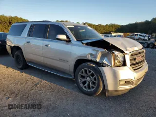 2015 GMC Yukon XL SLE z VIN 1GKS1GKC7FR285469, wystawiony jako Copart lot #81177424 z przebiegiem Nie podano mil oraz Czysty tytuł • Clean title. Historia ofert i sprzedaży dostępna na DreamBid. Obrazek 4.