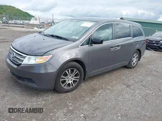 2012 Honda Odyssey EX-L with VIN 5FNRL5H68CB060487, listed as a IAAI auction lot 42176223 with 234,078 mi miles and . Bid and sale history available at DreamBid. Image 2.