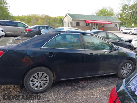 2014 Toyota Camry L with VIN 4T4BF1FK7ER395057, listed as a IAAI auction lot 42215441 with 166,247 mi miles and . Bid and sale history available at DreamBid. Image 14.