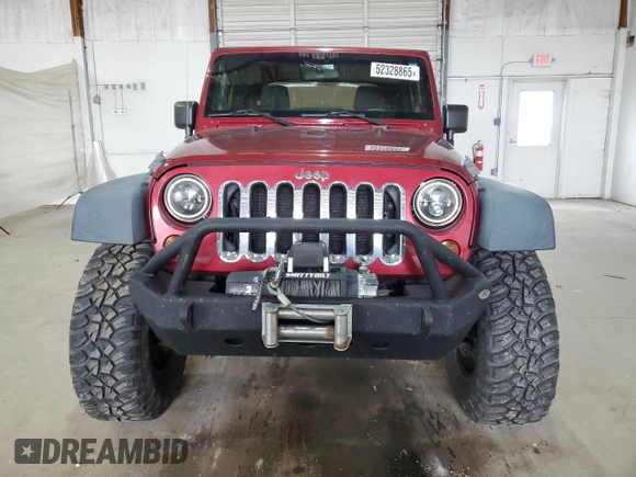 2012 Jeep Wrangler Sport with VIN 1C4AJWAG5CL233049, listed as a Copart auction lot 52328865 with 185,388 mi miles and Salvage title. Bid and sale history available at DreamBid. Image 5.