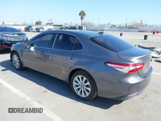 2019 Toyota Camry LE with VIN 4T1B11HK2KU240465, listed as a IAAI auction lot 42095075 with 67,852 mi miles and . Bid and sale history available at DreamBid. Image 3.