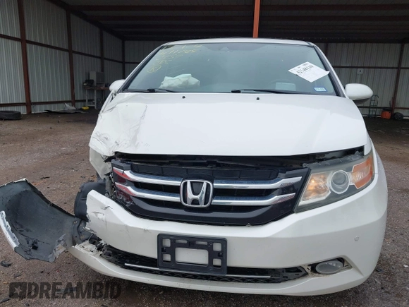 2014 Honda Odyssey Touring with VIN 5FNRL5H95EB059729, listed as a IAAI auction lot 42148110 with 135,304 mi miles and . Bid and sale history available at DreamBid. Image 6.