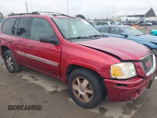 2004 GMC Envoy SLT with VIN 1GKDS13S042366165, listed as a IAAI auction lot 41677016 with 240,482 mi miles. Bid and sale history available at carsss.com. Image 1.