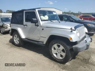 2009 Jeep Wrangler Sahara with VIN 1J4FA54119L747068, listed as a Copart auction lot 71209904 with 86,978 mi miles and Salvage title. Bid and sale history available at DreamBid. Image 4.