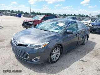 2014 Toyota Avalon Limited with VIN 4T1BK1EB3EU100754, listed as a IAAI auction lot 39446319 with 82,624 mi miles. Bid and sale history available at carsss.com. Image 2.