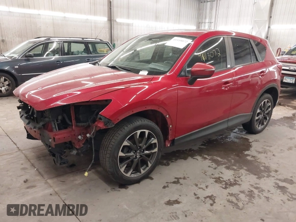 2016 Mazda CX-5 Grand Touring with VIN JM3KE4DY7G0731057, listed as a IAAI auction lot 41118072 with 134,107 mi miles and . Bid and sale history available at carsss.com. Image 18.
