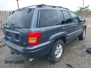 2000 Jeep Grand Cherokee Limited with VIN 1J4GW58N1YC395806, listed as a IAAI auction lot 42267747 with 180,120 mi miles and . Bid and sale history available at DreamBid. Image 4.