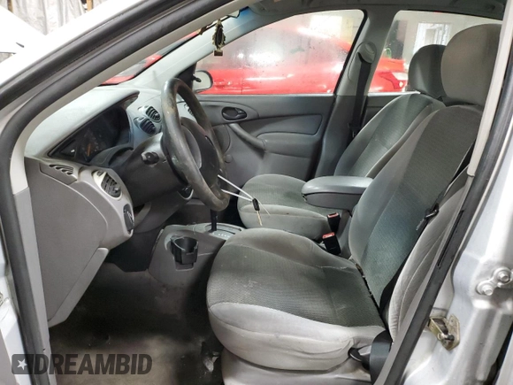 2003 Ford Focus LX z VIN 1FAFP33P03W313279, wystawiony jako Copart lot #89271495 z przebiegiem 152 672 mil mil oraz Szkoda całkowita • Salvage title. Historia ofert i sprzedaży dostępna na DreamBid. Obrazek 7.