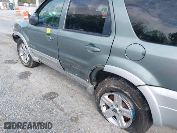 2007 Ford Escape Hybrid z VIN 1FMCU59HX7KB25010, wystawiony jako IAAI lot #42159589 z przebiegiem 217 254 mil mil oraz . Historia ofert i sprzedaży dostępna na DreamBid. Obrazek 6.