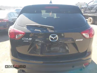 2014 Mazda CX-5 Grand Touring with VIN JM3KE4DY1E0339690, listed as a IAAI auction lot 41668780 with 216,825 mi miles. Bid and sale history available at carsss.com. Image 16.