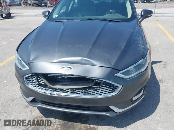 2020 Ford Fusion Titanium with VIN 3FA6P0D9XLR131042, listed as a IAAI auction lot 42560444 with 95,351 mi miles and . Bid and sale history available at DreamBid. Image 6.