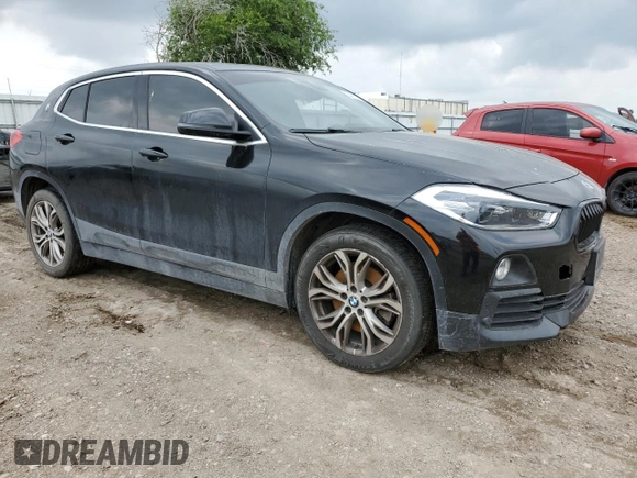 2019 BMW X2 sDrive28i with VIN WBXYJ3C52K5N14885, listed as a Copart auction lot 54079395 with 91,564 mi miles and Salvage title. Bid and sale history available at DreamBid. Image 4.