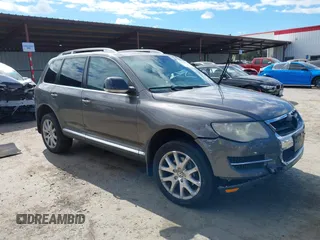 2010 Volkswagen Touareg VR6 with VIN WVGBF7A96AD002466, listed as a IAAI auction lot 41709052 with 204,819 mi miles and . Bid and sale history available at DreamBid. Image 1.