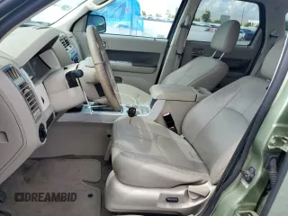 2009 Mercury Mariner Hybrid with VIN 4M2CU29399KJ17064, listed as a Copart auction lot 60263545 with 176,232 mi miles and Salvage title. Bid and sale history available at DreamBid. Image 7.