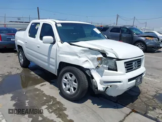2007 Honda Ridgeline RTL with VIN 2HJYK16557H532450, listed as a IAAI auction lot 42616761 with 302,848 mi miles and . Bid and sale history available at DreamBid. Image 1.