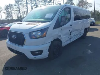 2024 Ford Transit Passenger XL with VIN 1FBAX2YGXRKA28228, listed as a IAAI auction lot 41557793 with 32,264 mi miles and . Bid and sale history available at DreamBid. Image 2.