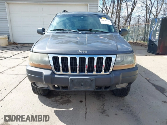 2003 Jeep Grand Cherokee Laredo with VIN 1J4GX48S53C504225, listed as a IAAI auction lot 41879669 with 247,246 mi miles. Bid and sale history available at carsss.com. Image 13.