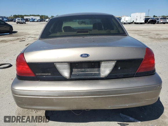 2003 Ford Police Interceptor Street Appear z VIN 2FAFP71W03X104811, wystawiony jako Copart lot #49307995 z przebiegiem 242 937 mil mil oraz Szkoda całkowita • Salvage title. Historia ofert i sprzedaży dostępna na DreamBid. Obrazek 6.