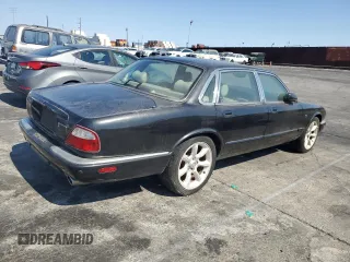 2003 Jaguar XJ with VIN SAJDA15B63MF52618, listed as a Copart auction lot 64336415 with Not provided miles and Clean title. Bid and sale history available at DreamBid. Image 3.