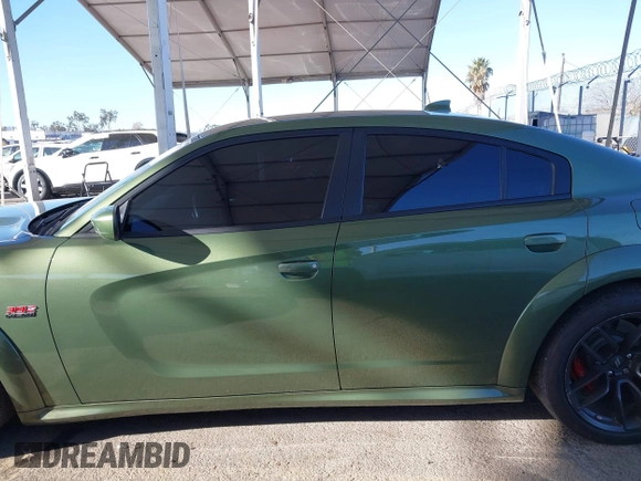 2022 Dodge Charger Scat Pack Widebody with VIN 2C3CDXGJ1NH216763, listed as a IAAI auction lot 41259159 with 32,610 mi miles and . Bid and sale history available at DreamBid. Image 14.